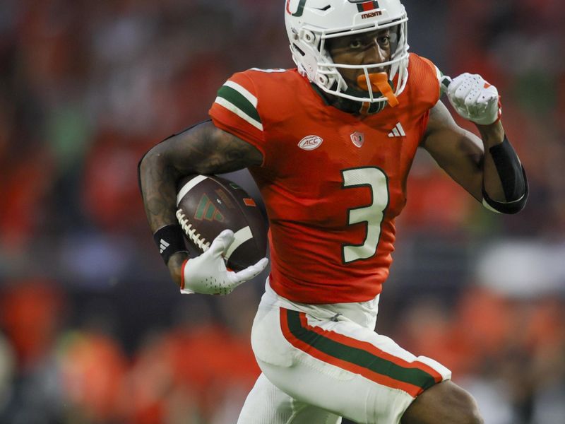 Sep 9, 2023; Miami Gardens, Florida, USA; Miami Hurricanes wide receiver Jacolby George (3) runs with the football for a touchdown against the Texas A&M Aggies during the fourth quarter at Hard Rock Stadium. Mandatory Credit: Sam Navarro-USA TODAY Sports