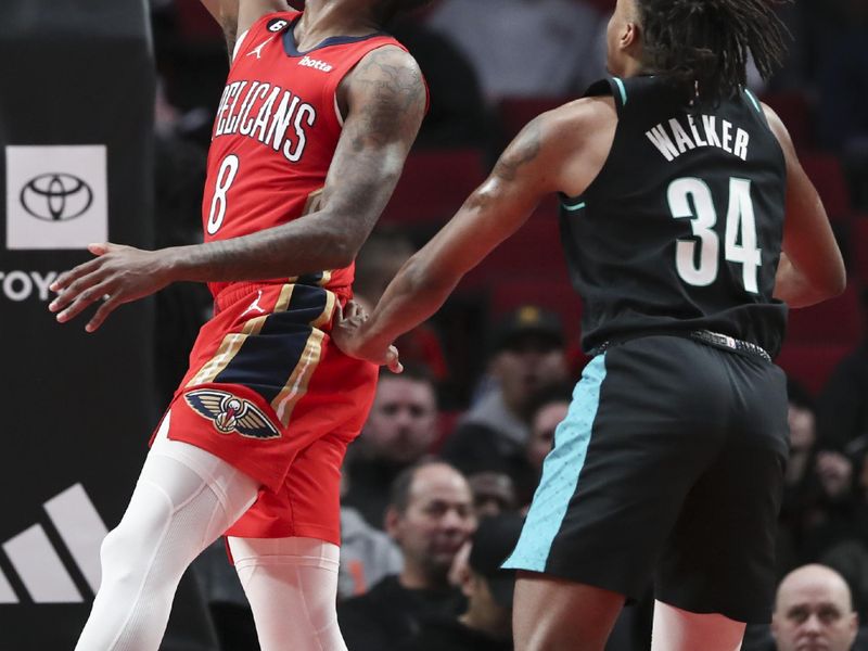 PORTLAND, OREGON - MARCH 27: Naji Marshall #8 of the New Orleans Pelicans drives to the basket as Jabari Walker #34 of the Portland Trail Blazers defends during the fourth quarter at Moda Center on March 27, 2023 in Portland, Oregon. NOTE TO USER: User expressly acknowledges and agrees that, by downloading and or using this photograph, user is consenting to the terms and conditions of the Getty Images License Agreement. (Photo by Amanda Loman/Getty Images)