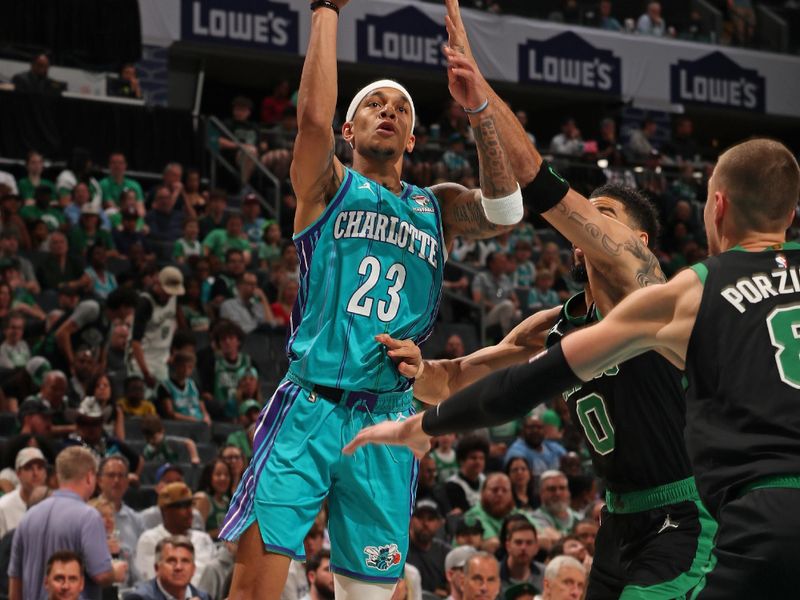 CHARLOTTE, NC - APRIL 1: Tre Mann #23 of the Charlotte Hornets shoots the ball during the game against the Boston Celtics on April 1, 2024 at Spectrum Center in Charlotte, North Carolina. NOTE TO USER: User expressly acknowledges and agrees that, by downloading and or using this photograph, User is consenting to the terms and conditions of the Getty Images License Agreement. Mandatory Copyright Notice: Copyright 2024 NBAE (Photo by Kent Smith/NBAE via Getty Images)