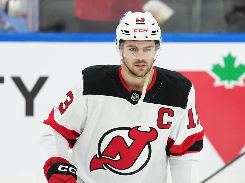 Dec 30, 2025; Toronto, Ontario, CAN; New Jersey Devils center Nico Hischier (13) skates during the warmup before a game against the Toronto Maple Leafs at Scotiabank Arena. Mandatory Credit: Nick Turchiaro-Imagn Images