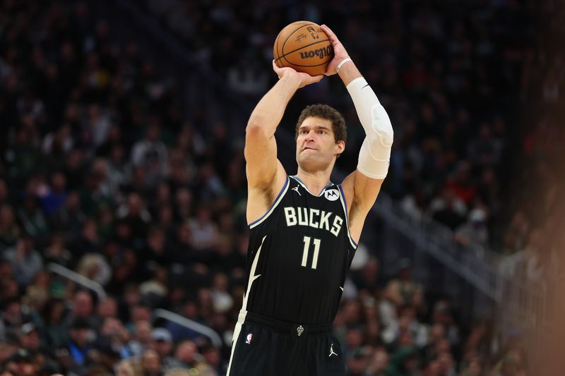 MILWAUKEE, WISCONSIN - JANUARY 27: Brook Lopez #11 of the Milwaukee Bucks takes a three point shot during the second half of a game against the New Orleans Pelicans at Fiserv Forum on January 27, 2024 in Milwaukee, Wisconsin. NOTE TO USER: User expressly acknowledges and agrees that, by downloading and or using this photograph, User is consenting to the terms and conditions of the Getty Images License Agreement. (Photo by Stacy Revere/Getty Images)