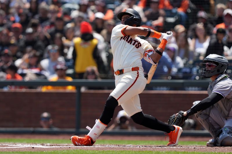 May 3, 2025; San Francisco, California, USA; San Francisco Giants designated hitter Luis Matos (29) hits a home run against the Colorado Rockies during the third inning at Oracle Park. Mandatory Credit: Darren Yamashita-Imagn Images