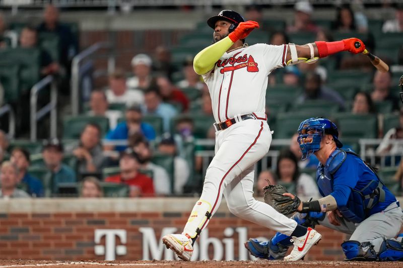 Sep 27, 2023; Cumberland, Georgia, USA; Atlanta Braves designated hitter Marcell Ozuna (20) hits a home run against the Chicago Cubs during the ninth inning at Truist Park. Mandatory Credit: Dale Zanine-USA TODAY Sports