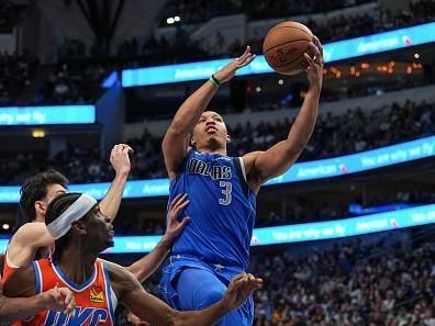 DALLAS, TX - DECEMBER 2: Grant Williams #3 of the Dallas Mavericks goes to the basket during the game on December 2, 2023 at the American Airlines Center in Dallas, Texas. NOTE TO USER: User expressly acknowledges and agrees that, by downloading and or using this photograph, User is consenting to the terms and conditions of the Getty Images License Agreement. Mandatory Copyright Notice: Copyright 2023 NBAE (Photo by Glenn James/NBAE via Getty Images)