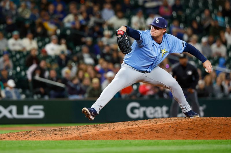 Aug 27, 2024; Seattle, Washington, USA; Tampa Bay Rays relief pitcher Colin Poche (38) throws against the Seattle Mariners during the eighth inning at T-Mobile Park. Mandatory Credit: Joe Nicholson-USA TODAY Sports