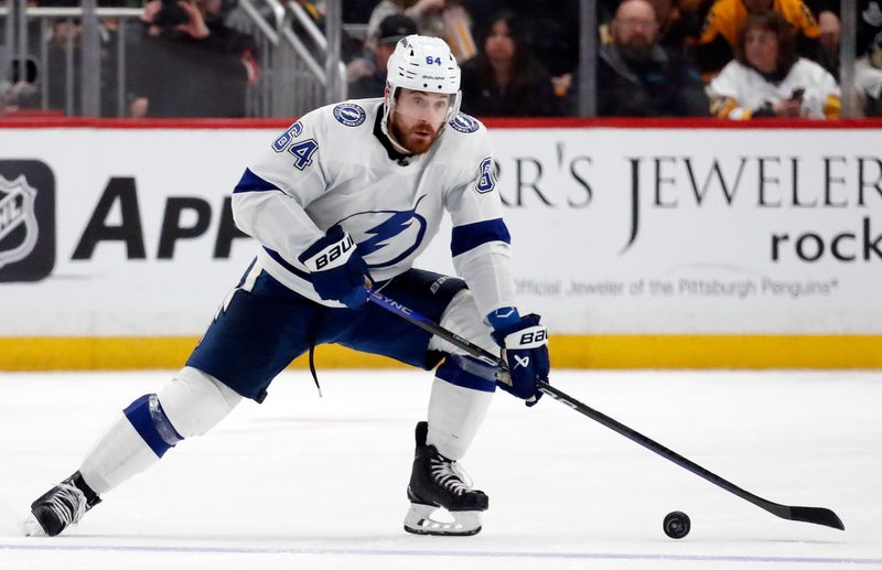 Apr 6, 2024; Pittsburgh, Pennsylvania, USA;  Tampa Bay Lightning center Tyler Motte (64) skates with the puck against the Pittsburgh Penguins during the second period at PPG Paints Arena. Mandatory Credit: Charles LeClaire-USA TODAY Sports