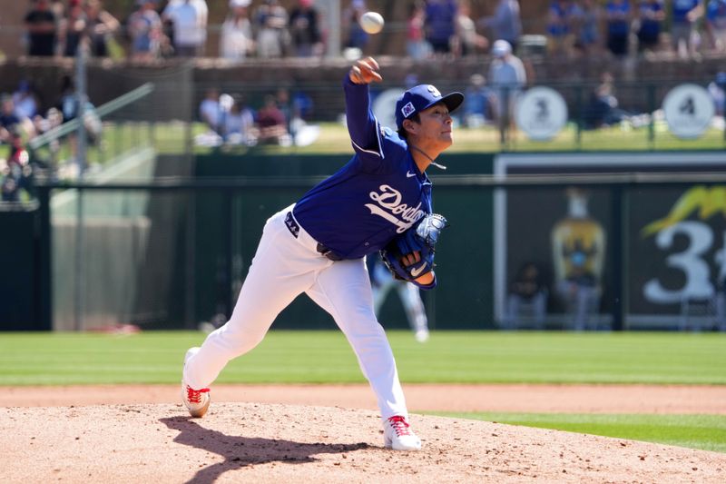 Mar 10, 2025; Phoenix, Arizona, USA; Los Angeles Dodgers pitcher Yoshinobu Yamamoto (18) pitches against the Arizona Diamondbacks during the second inning at Camelback Ranch-Glendale. Mandatory Credit: Joe Camporeale-Imagn Images