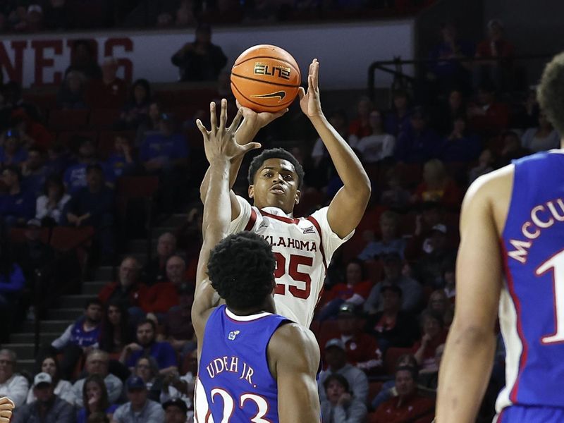 Feb 11, 2023; Norman, Oklahoma, USA; Oklahoma Sooners guard Grant Sherfield (25) shoots a three point basket over Kansas Jayhawks center Ernest Udeh Jr. (23) during the second half at Lloyd Noble Center. Kansas won 78-55. Mandatory Credit: Alonzo Adams-USA TODAY Sports