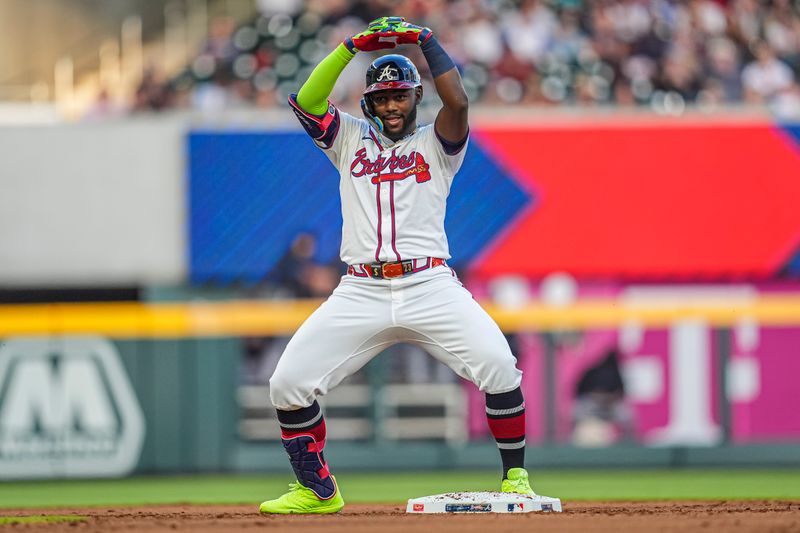 Apr 23, 2024; Cumberland, Georgia, USA; Atlanta Braves outfielder Michael Harris II (23) reacts after hitting a double to drive in a run against the Miami Marlins during the second inning at Truist Park. Mandatory Credit: Dale Zanine-USA TODAY Sports