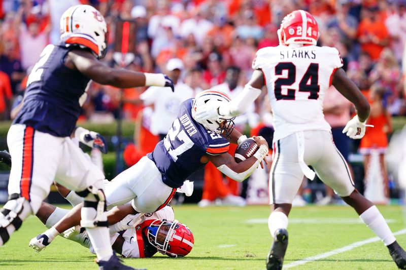 Sep 30, 2023; Auburn, Alabama, USA; Auburn Tigers running back Jarquez Hunter (27) dives for a touchdown against the Georgia Bulldogs during the first quarter at Jordan-Hare Stadium. Mandatory Credit: John David Mercer-USA TODAY Sports