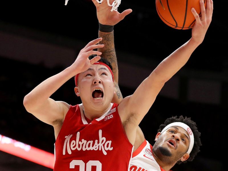 Feb 29, 2024; Columbus, Ohio, USA;  Nebraska Cornhuskers guard Keisei Tominaga (30) moves to the basket as Ohio State Buckeyes guard Roddy Gayle Jr. (1) during the first half at Value City Arena. Mandatory Credit: Joseph Maiorana-USA TODAY Sports