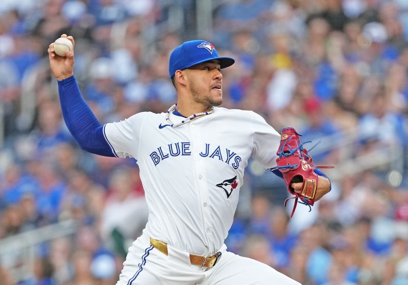 Aug 9, 2024; Toronto, Ontario, CAN; Toronto Blue Jays starting pitcher Jose Berríos (17) throws a pitch against the Oakland Athletics during the first inning at Rogers Centre. Mandatory Credit: Nick Turchiaro-USA TODAY Sports