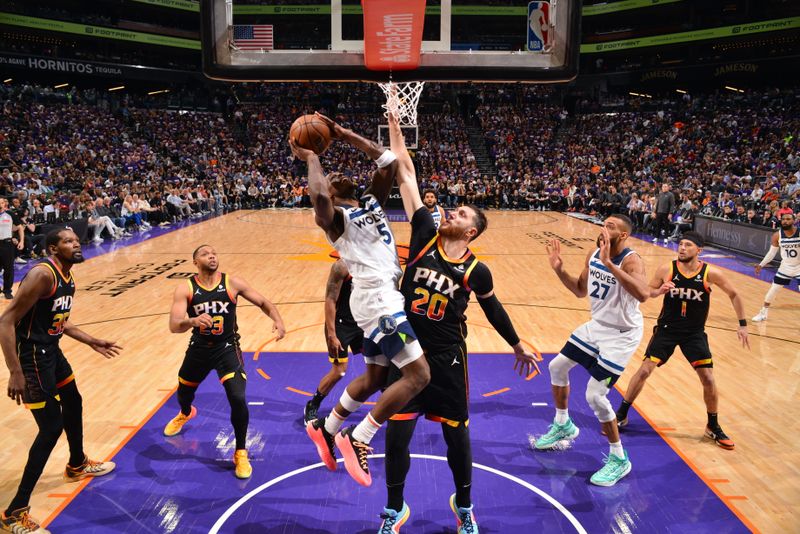 PHOENIX, AZ - APRIL 26:  Anthony Edwards #5 of the Minnesota Timberwolves drives to the basket during the game against the Phoenix Suns during Round 1 Game 3 of the 2024 NBA Playoffs on April 26, 2024 at Footprint Center in Phoenix, Arizona. NOTE TO USER: User expressly acknowledges and agrees that, by downloading and or using this photograph, user is consenting to the terms and conditions of the Getty Images License Agreement. Mandatory Copyright Notice: Copyright 2024 NBAE (Photo by Barry Gossage/NBAE via Getty Images)