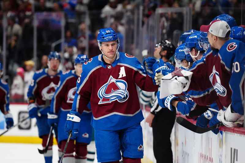 Dec 31, 2023; Denver, Colorado, USA; Colorado Avalanche right wing Mikko Rantanen (96) celebrates his power play goal in the first period against the San Jose Sharks at Ball Arena. Mandatory Credit: Ron Chenoy-USA TODAY Sports