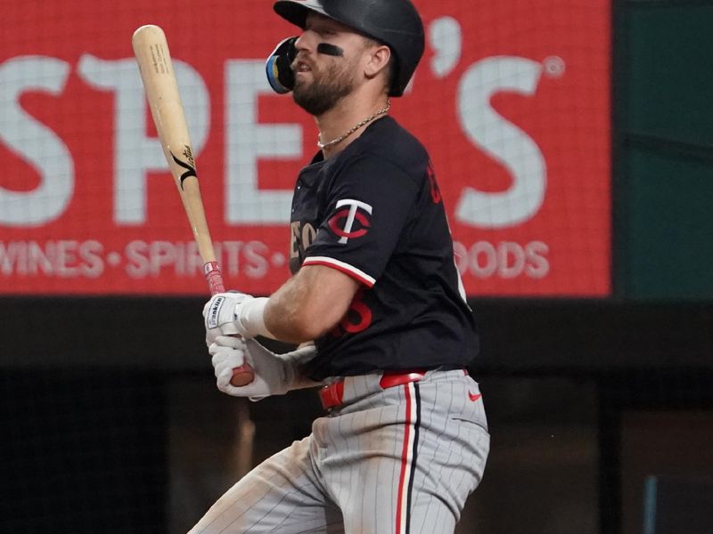 Sep 23, 2025; Arlington, Texas, USA; Minnesota Twins second baseman Kody Clemens (18) hits an RBI single during the sixth inning against the Texas Rangers at Globe Life Field. Mandatory Credit: Raymond Carlin III-Imagn Images