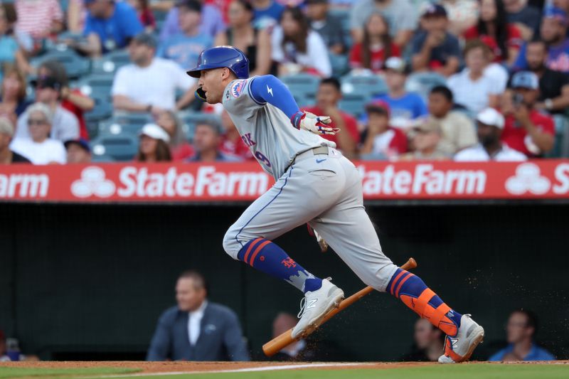 Aug 2, 2024; Anaheim, California, USA;  New York Mets left fielder Brandon Nimmo (9) hits a single during the first inning against the Los Angeles Angels at Angel Stadium. Mandatory Credit: Kiyoshi Mio-USA TODAY Sports