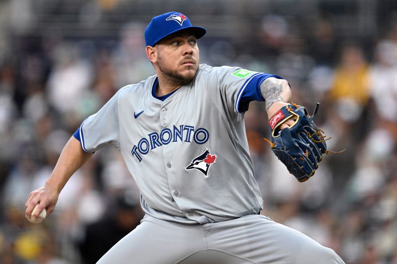 Apr 19, 2024; San Diego, California, USA; Toronto Blue Jays starting pitcher Yariel Rodriguez (29) throws a pitch against the San Diego Padres during the first inning at Petco Park. Mandatory Credit: Orlando Ramirez-USA TODAY Sports 