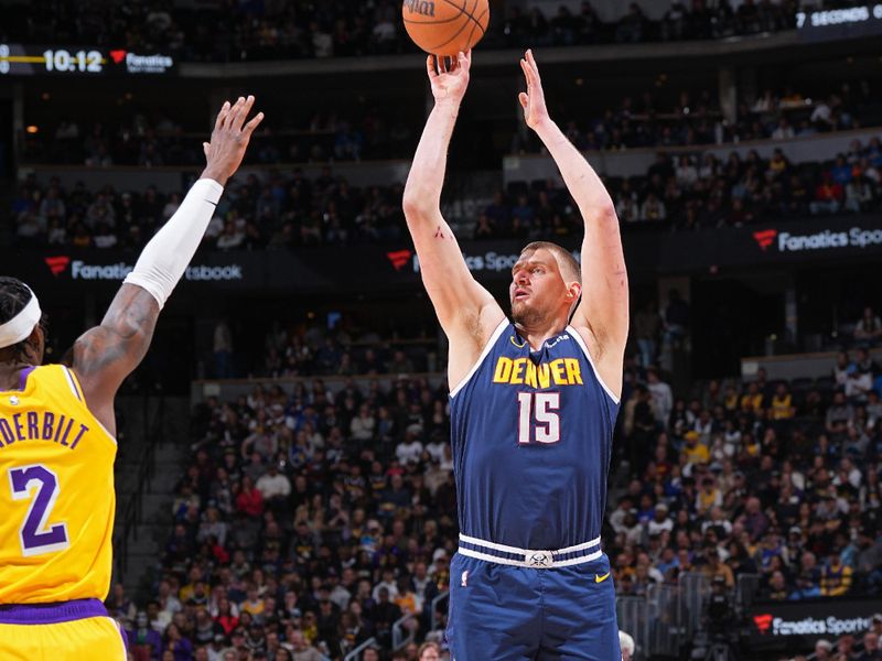 DENVER, CO - MARCH 14: Nikola Jokic #15 of the Denver Nuggets three point basket during the game against the Los Angeles Lakers on March 14, 2025 at Ball Arena in Denver, Colorado. NOTE TO USER: User expressly acknowledges and agrees that, by downloading and/or using this Photograph, user is consenting to the terms and conditions of the Getty Images License Agreement. Mandatory Copyright Notice: Copyright 2025 NBAE(Photo by Garrett Ellwood/NBAE via Getty Images)