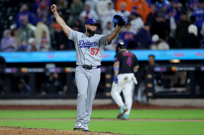 May 23, 2025; New York City, New York, USA; Los Angeles Dodgers relief pitcher Luis Garcia (57) reacts after getting New York Mets catcher Francisco Alvarez (4) to line out for the final out of the game during the thirteenth inning at Citi Field. Mandatory Credit: Brad Penner-Imagn Images