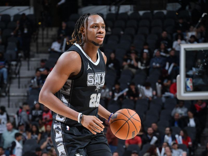 SAN ANTONIO, TX - DECEMBER 5: Charles Bassey #28 of the San Antonio Spurs dribbles the ball during the game against the Chicago Bulls on December 5, 2024 at the Frost Bank Center in San Antonio, Texas. NOTE TO USER: User expressly acknowledges and agrees that, by downloading and or using this photograph, user is consenting to the terms and conditions of the Getty Images License Agreement. Mandatory Copyright Notice: Copyright 2024 NBAE (Photos by Michael Gonzales/NBAE via Getty Images)