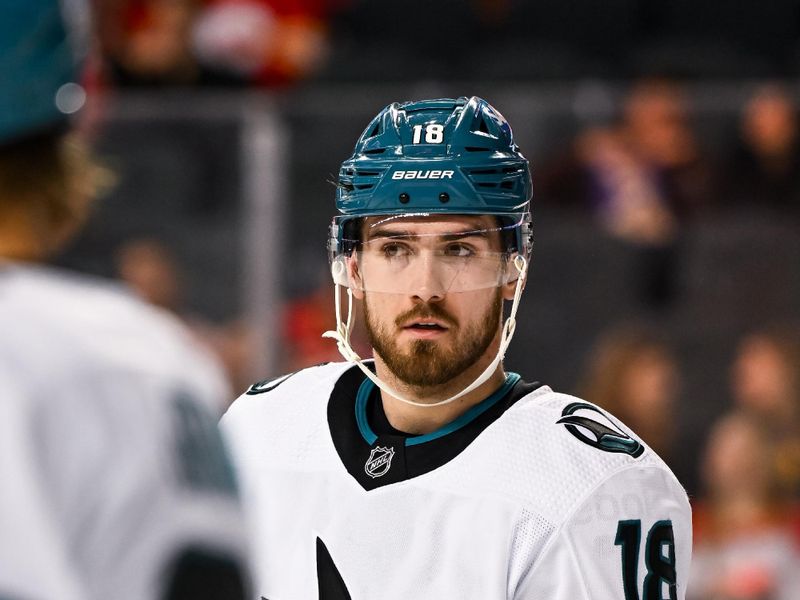 Feb 15, 2024; Calgary, Alberta, CAN; San Jose Sharks right wing Filip Zadina (18) looks on before a face-off against the Calgary Flames during the third period at Scotiabank Saddledome. Mandatory Credit: Brett Holmes-USA TODAY Sports