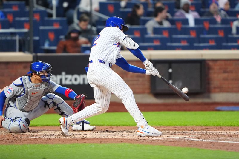 Apr 30, 2024; New York City, New York, USA; New York Mets third baseman Brett Baty (22) hits a single against the Chicago Cubs during the second inning at Citi Field. Mandatory Credit: Gregory Fisher-USA TODAY Sports