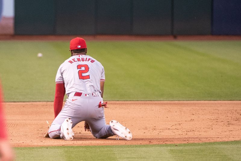 Jul 2, 2024; Oakland, California, USA; Los Angeles Angels third baseman Luis Rengifo (2) is unable to make the play during the sixth inning of the game against the Oakland Athletics at Oakland-Alameda County Coliseum. Mandatory Credit: Ed Szczepanski-USA TODAY Sports