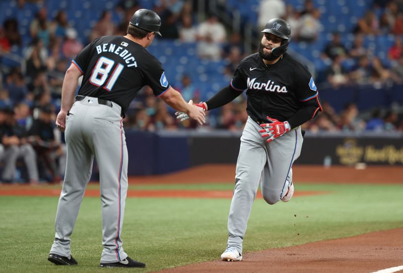 Jul 30, 2024; St. Petersburg, Florida, USA; Miami Marlins third base Emmanuel Rivera (15) is congratulated by Miami Marlins third base coach Griffin Benedict (81) after he hit a two-run home run against the Tampa Bay Rays during the first inning at Tropicana Field. Mandatory Credit: Kim Klement Neitzel-USA TODAY Sports