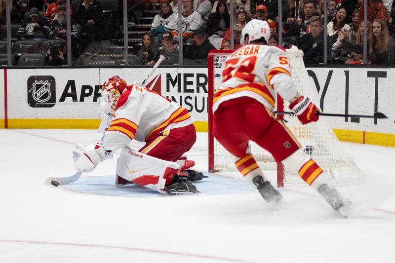 Mar 1, 2026; Anaheim, California, USA; Calgary Flames goaltender Devin Cooley (1) with a save during overtime in the match against the Anaheim Ducks at Honda Center. Mandatory Credit: Corinne Votaw-Imagn Images