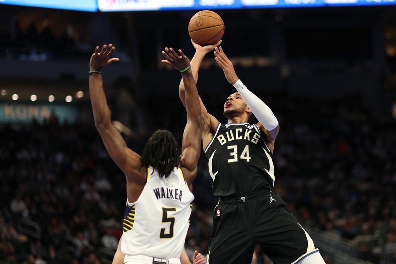 MILWAUKEE, WISCONSIN - NOVEMBER 22: Giannis Antetokounmpo #34 of the Milwaukee Bucks shoots over Jarace Walker #5 of the Indiana Pacers during the second half of a game in the NBA Emirates Cup at Fiserv Forum on November 22, 2024 in Milwaukee, Wisconsin. NOTE TO USER: User expressly acknowledges and agrees that, by downloading and or using this photograph, User is consenting to the terms and conditions of the Getty Images License Agreement. (Photo by Stacy Revere/Getty Images)