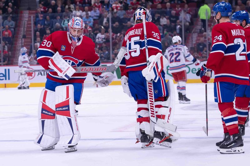 Oct 22, 2024; Ottawa, Ontario, CAN; Montreal Canadiens starting goalie Sam Montembeault (35) is replaced by Cayden Primeau (30) after letting in four goals in the first period against the New York Rangers  at the Bell Centre. Mandatory Credit: Marc DesRosiers-Imagn Images