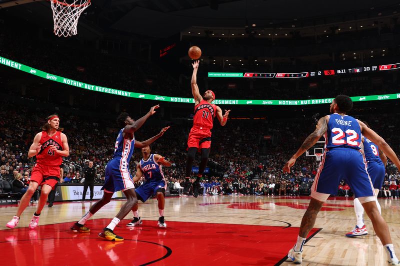 TORONTO, CANADA - MARCH 31: Bruce Brown #11 of the Toronto Raptors drives to the basket during the game against the Philadelphia 76ers on March 31, 2024 at the Scotiabank Arena in Toronto, Ontario, Canada.  NOTE TO USER: User expressly acknowledges and agrees that, by downloading and or using this Photograph, user is consenting to the terms and conditions of the Getty Images License Agreement.  Mandatory Copyright Notice: Copyright 2024 NBAE (Photo by Vaughn Ridley/NBAE via Getty Images)