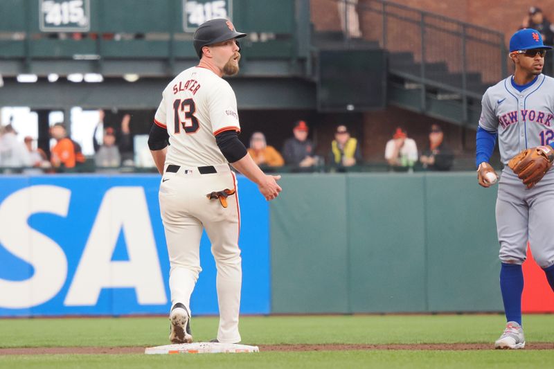 Apr 24, 2024; San Francisco, California, USA; San Francisco Giants right fielder Austin Slater (13) is caught taking a lead off second base by New York Mets shortstop Francisco Lindor (12) during the third inning at Oracle Park. Mandatory Credit: Kelley L Cox-USA TODAY Sports