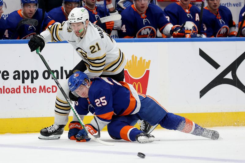 Mar 2, 2024; Elmont, New York, USA; Boston Bruins left wing James van Riemsdyk (21) and New York Islanders defenseman Sebastian Aho (25) fight for the puck during the first period at UBS Arena. Mandatory Credit: Brad Penner-USA TODAY Sports