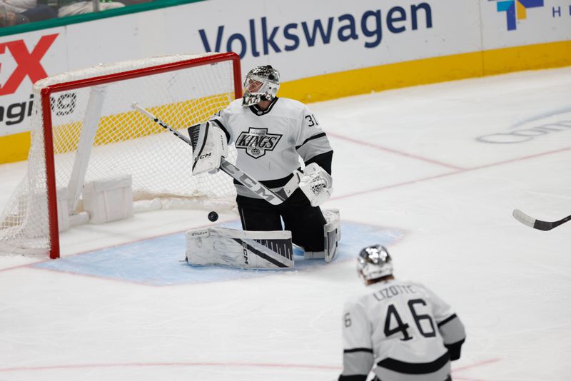 Mar 16, 2024; Dallas, Texas, USA; A puck gets past Los Angeles Kings goaltender David Rittich (31) during the first period against the Dallas Stars at American Airlines Center. Mandatory Credit: Andrew Dieb-USA TODAY Sports