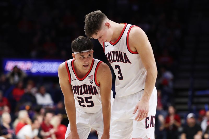 Jan 5, 2023; Tucson, Arizona, USA; Arizona Wildcats guard Kerr Kriisa (25) and guard Pelle Larsson (3) talk at mid court during the second half at McKale Center. Mandatory Credit: Zachary BonDurant-USA TODAY Sports