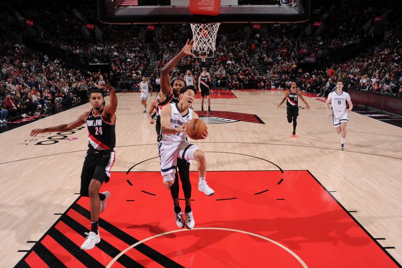 PORTLAND, OR - NOVEMBER 10: Yuki Kawamura #17 of the Memphis Grizzlies shoots the ball during the game against the Portland Trail Blazers on November 10, 2024 at the Moda Center Arena in Portland, Oregon. NOTE TO USER: User expressly acknowledges and agrees that, by downloading and or using this photograph, user is consenting to the terms and conditions of the Getty Images License Agreement. Mandatory Copyright Notice: Copyright 2024 NBAE (Photo by Cameron Browne/NBAE via Getty Images)