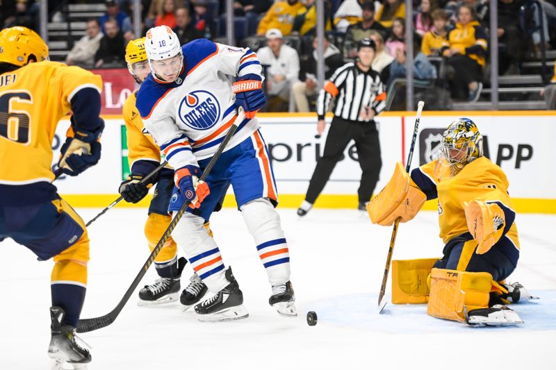 Oct 17, 2024; Nashville, Tennessee, USA;  Nashville Predators goaltender Juuse Saros (74) blocks the shot of Edmonton Oilers left wing Zach Hyman (18) during the second period at Bridgestone Arena. Mandatory Credit: Steve Roberts-Imagn Images