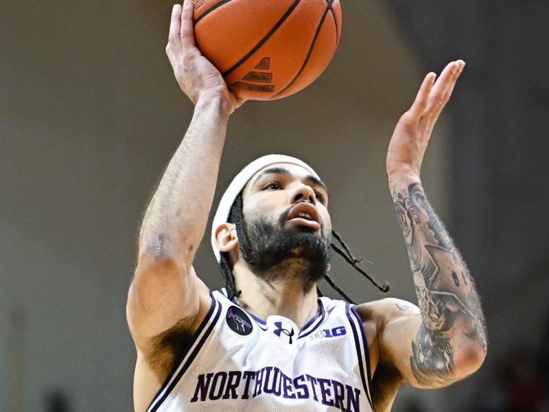 Feb 18, 2024; Bloomington, Indiana, USA;  Northwestern Wildcats guard Boo Buie (0) attempts a shot against the Indiana Hoosiers during the second half at Simon Skjodt Assembly Hall. Mandatory Credit: Robert Goddin-USA TODAY Sports