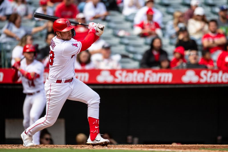 Oct 1, 2023; Anaheim, California, USA; Los Angeles Angels first baseman Brandon Drury (23) doubles against the Oakland Athletics during the fourth inning at Angel Stadium. Mandatory Credit: Jonathan Hui-USA TODAY Sports