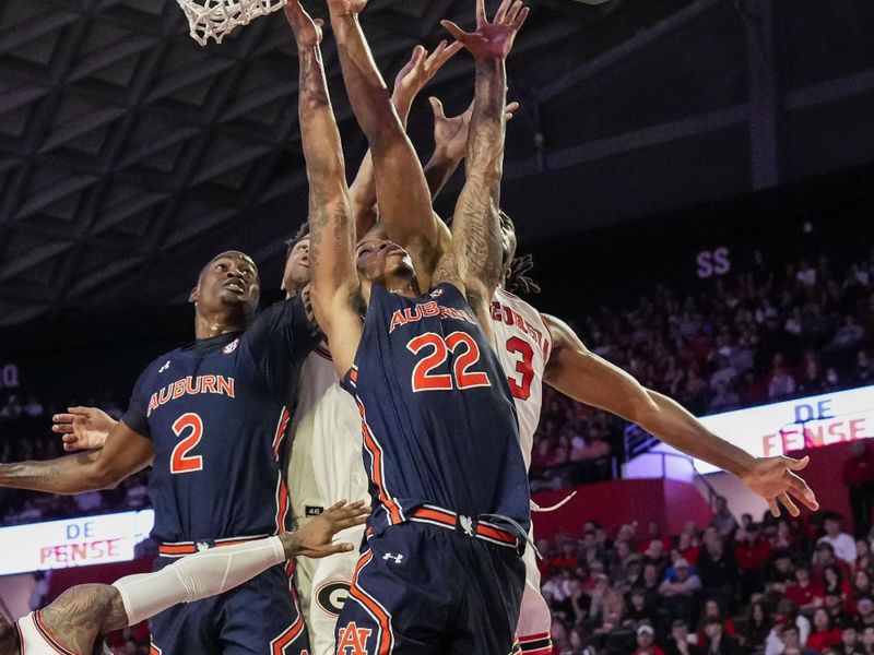 Jan 4, 2023; Athens, Georgia, USA; Multiple players including Auburn Tigers guard Allen Flanigan (22) and Georgia Bulldogs guard Kario Oquendo (3) reach for a rebound during the first half at Stegeman Coliseum. Mandatory Credit: Dale Zanine-USA TODAY Sports