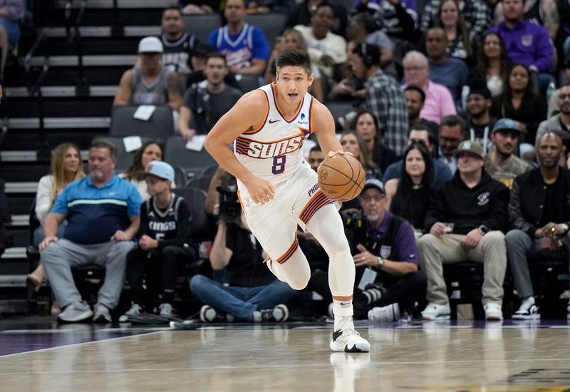 SACRAMENTO, CALIFORNIA - APRIL 12: Grayson Allen #8 of the Phoenix Suns dribbles the ball up court against the Sacramento Kings during the first half of an NBA basketball game at Golden 1 Center on April 12, 2024 in Sacramento, California. NOTE TO USER: User expressly acknowledges and agrees that, by downloading and or using this photograph, User is consenting to the terms and conditions of the Getty Images License Agreement. (Photo by Thearon W. Henderson/Getty Images)