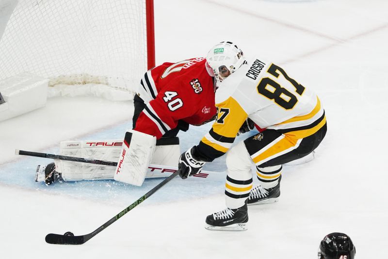 Dec 28, 2025; Chicago, Illinois, USA; Pittsburgh Penguins center Sidney Crosby (87) skates in on Chicago Blackhawks goaltender Arvid Soderblom (40) during the second period at United Center. Mandatory Credit: David Banks-Imagn Images