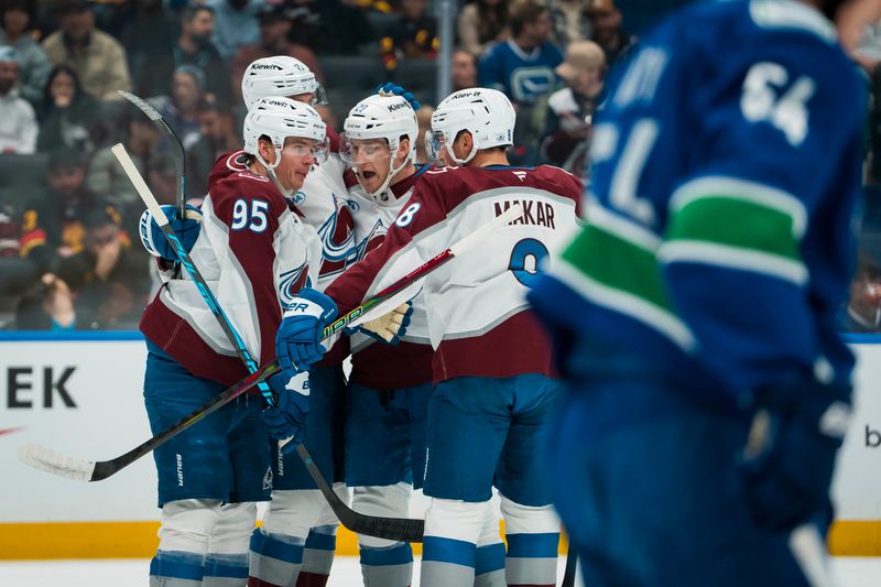 Nov 9, 2025; Vancouver, British Columbia, CAN; Colorado Avalanche forward Victor Olofsson (95) and forward Valeri Nichushkin (13) and forward Nathan MacKinnon (29) and defenseman Cale Makar (8) celebrate MacKinnion’s second goal of the game against the Vancouver Canucks in the first period at Rogers Arena. Mandatory Credit: Bob Frid-Imagn Images