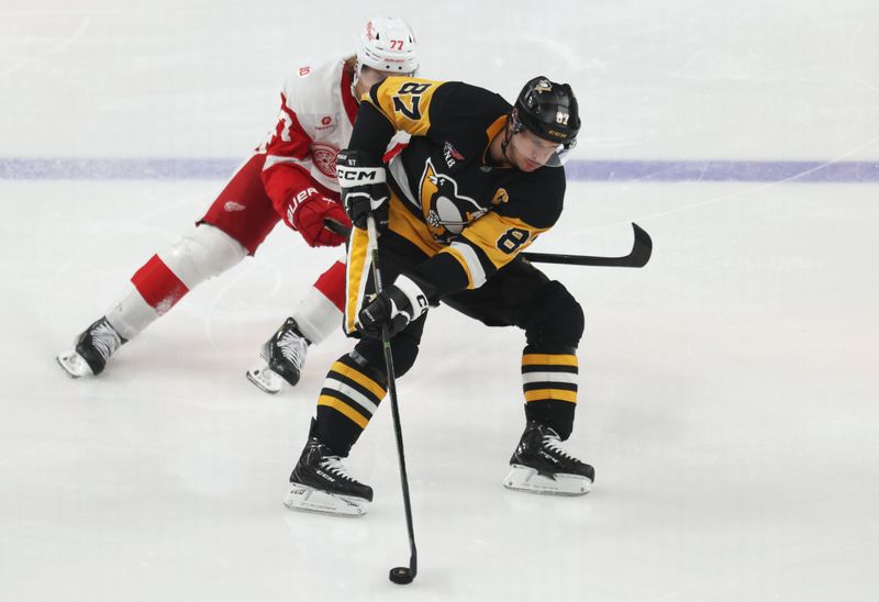 Mar 31, 2026; Pittsburgh, Pennsylvania, USA; Pittsburgh Penguins center Sidney Crosby (87) handles the puck against Detroit Red Wings defenseman Simon Edvinsson (77) during the third period at PPG Paints Arena. Mandatory Credit: Charles LeClaire-Imagn Images Mar 31, 2026; Pittsburgh, Pennsylvania, USA; Pittsburgh Penguins center Sidney Crosby (87) handles the puck against Detroit Red Wings defenseman Simon Edvinsson (77) during the third period at PPG Paints Arena. Mandatory Credit: Charles LeClaire-Imagn Images