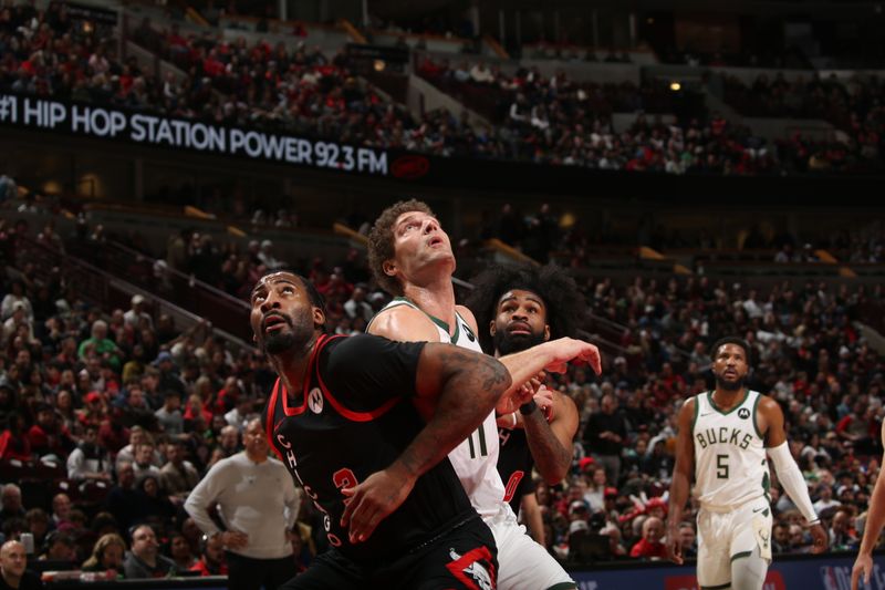 CHICAGO, IL - MARCH 1: Andre Drummond #3 and Coby White #0 of the Chicago Bulls box out against Brook Lopez #11 of the Milwaukee Bucks during the game on March 1, 2024 at United Center in Chicago, Illinois. NOTE TO USER: User expressly acknowledges and agrees that, by downloading and or using this photograph, User is consenting to the terms and conditions of the Getty Images License Agreement. Mandatory Copyright Notice: Copyright 2024 NBAE (Photo by Gary Dineen/NBAE via Getty Images)