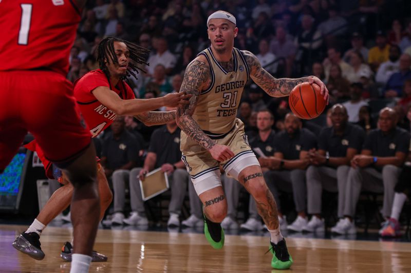 Mar 1, 2025; Atlanta, Georgia, USA; Georgia Tech Yellow Jackets forward Duncan Powell (31) drives to the basket against the North Carolina State Wolfpack in the second half at McCamish Pavilion. Mandatory Credit: Brett Davis-Imagn Images