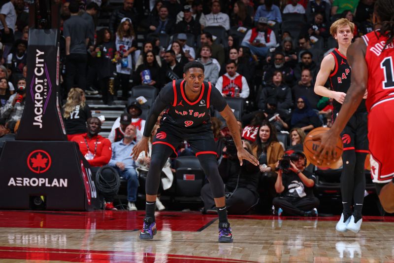 TORONTO, CANADA - JANUARY 31:  RJ Barrett #9 of the Toronto Raptors plays defense during the game against the Chicago Bulls on January 31, 2025 at the Scotiabank Arena in Toronto, Ontario, Canada.  NOTE TO USER: User expressly acknowledges and agrees that, by downloading and or using this Photograph, user is consenting to the terms and conditions of the Getty Images License Agreement.  Mandatory Copyright Notice: Copyright 2025 NBAE (Photo by Vaughn Ridley/NBAE via Getty Images)