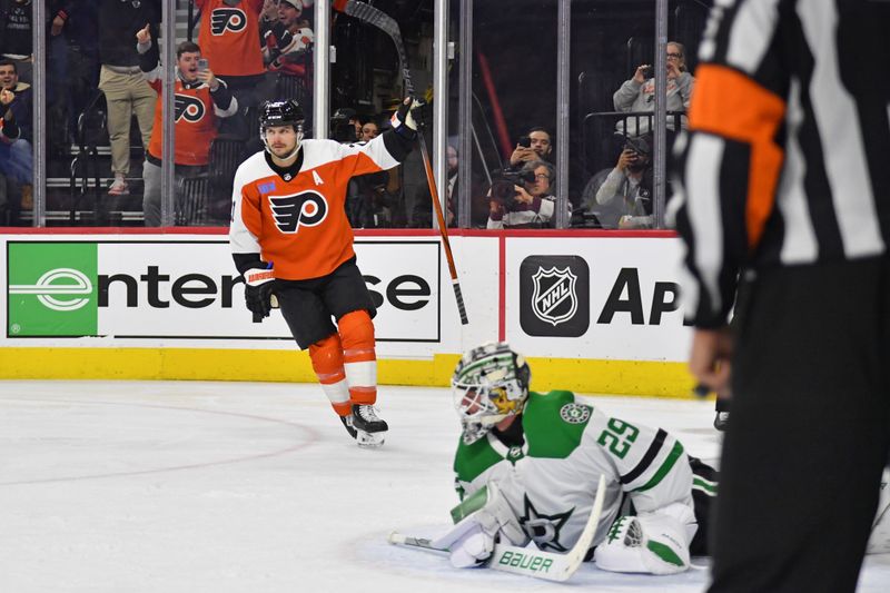 Jan 18, 2024; Philadelphia, Pennsylvania, USA; Philadelphia Flyers center Scott Laughton (21) celebrates his penalty shot goal against Dallas Stars goaltender Jake Oettinger (29) during the third period at Wells Fargo Center. Mandatory Credit: Eric Hartline-USA TODAY Sports