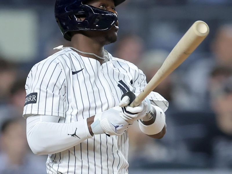 Jun 3, 2025; Bronx, New York, USA; New York Yankees third baseman Jazz Chisholm Jr. (13) watches his solo home run against the Cleveland Guardians during the seventh inning at Yankee Stadium. Mandatory Credit: Brad Penner-Imagn Images